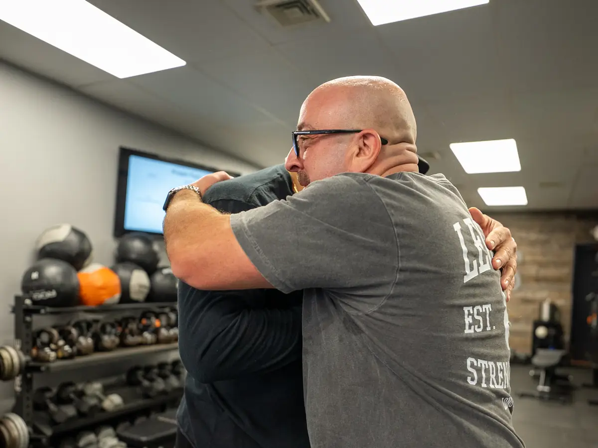 Joey Olivo, founder of Legacy Strength, with a member