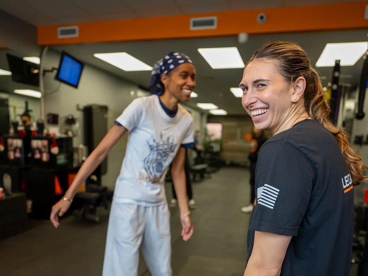 A coach working one to one with a member at Legacy Strength in Floral Park